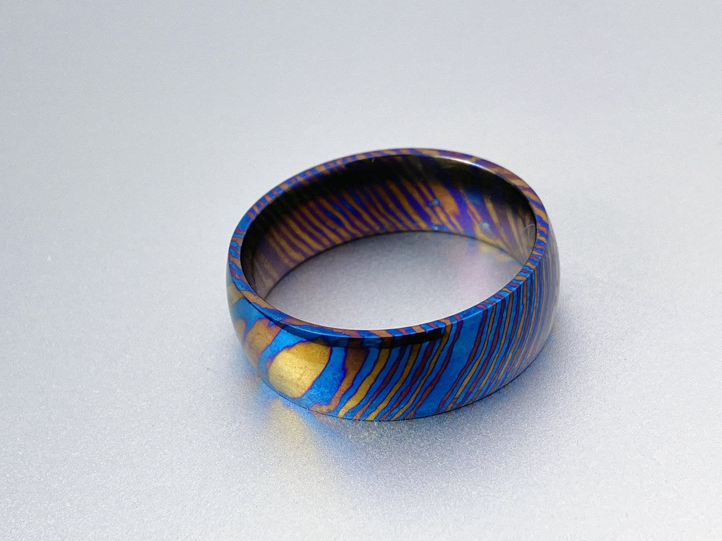 Customized Mokume Ti (TiDamascus) ring, three alloys twisted pattern. ~1weeks, please tell us the size when you place order