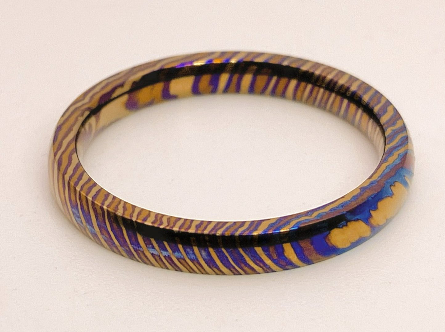 Customized Mokume Ti (TiDamascus) ring, three alloys twisted pattern. ~1weeks, please tell us the size when you place order