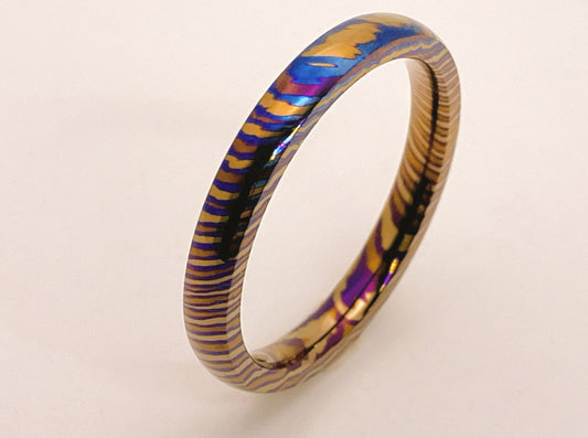 Customized Mokume Ti (TiDamascus) ring, three alloys twisted pattern. 4~6weeks, please tell us the size  when you place order