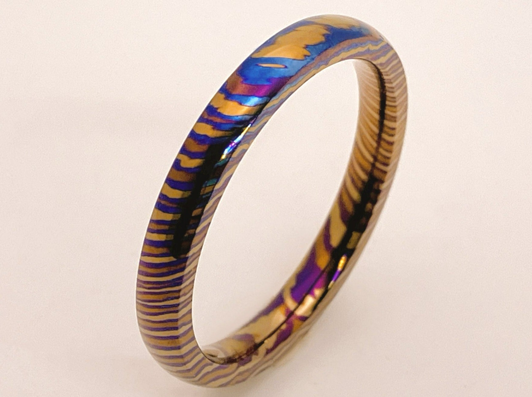 Customized Mokume Ti (TiDamascus) ring, three alloys twisted pattern ...